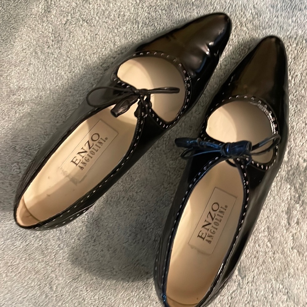 Enzo Angiolini black patent leather shoes with leather ties.